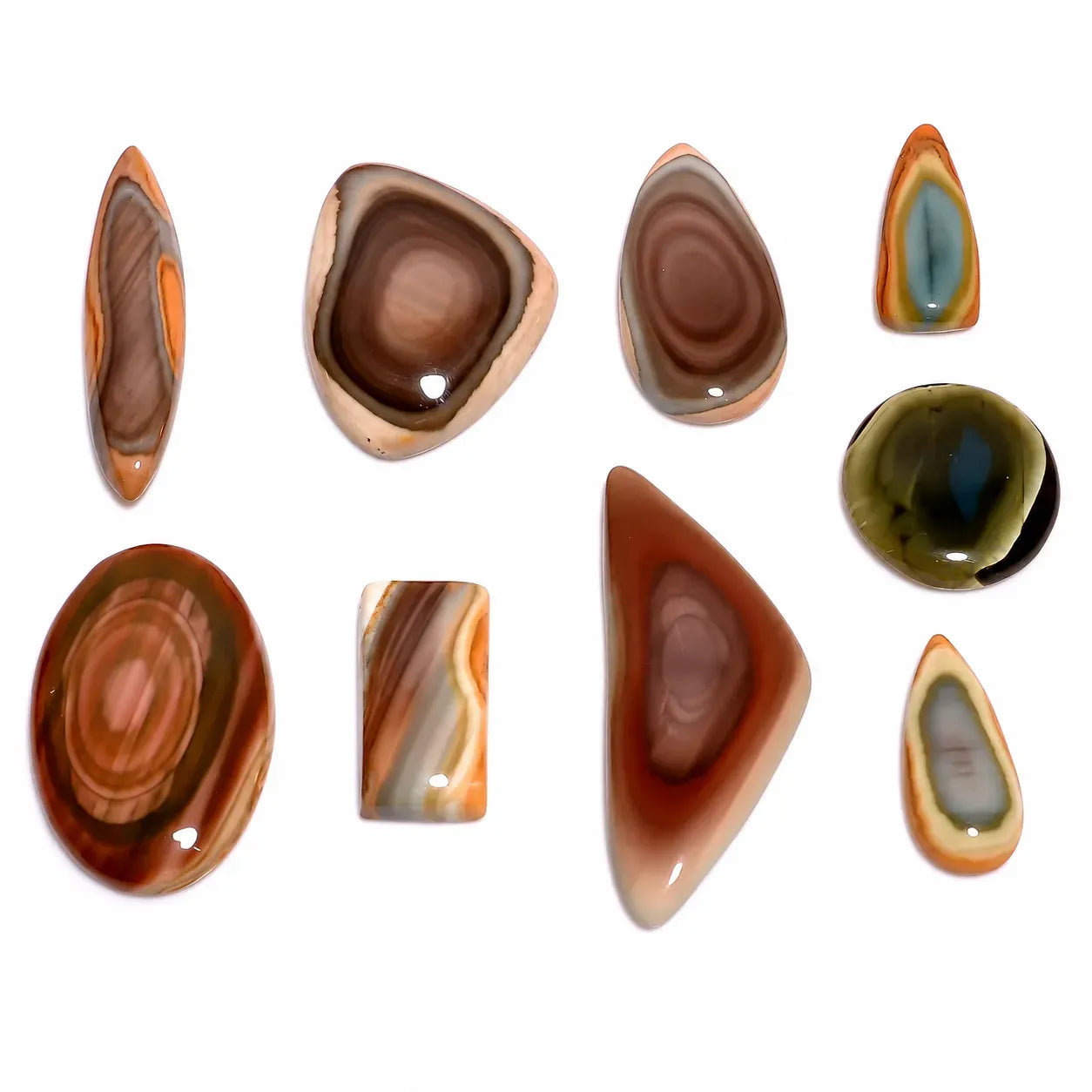 Collection of various shaped and colored stones on a white background
