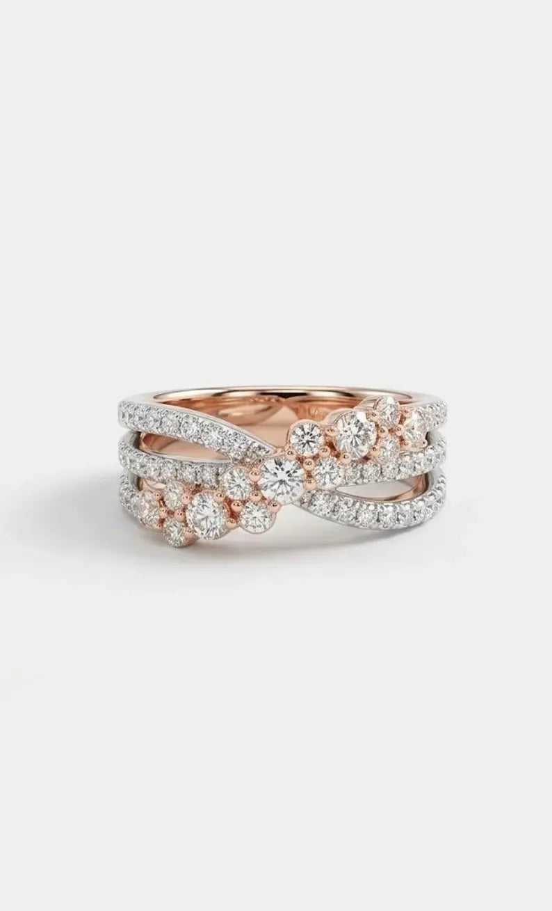 Front view of a 925 sterling silver crossover ring with three rows and a rose gold plated CZ cluster