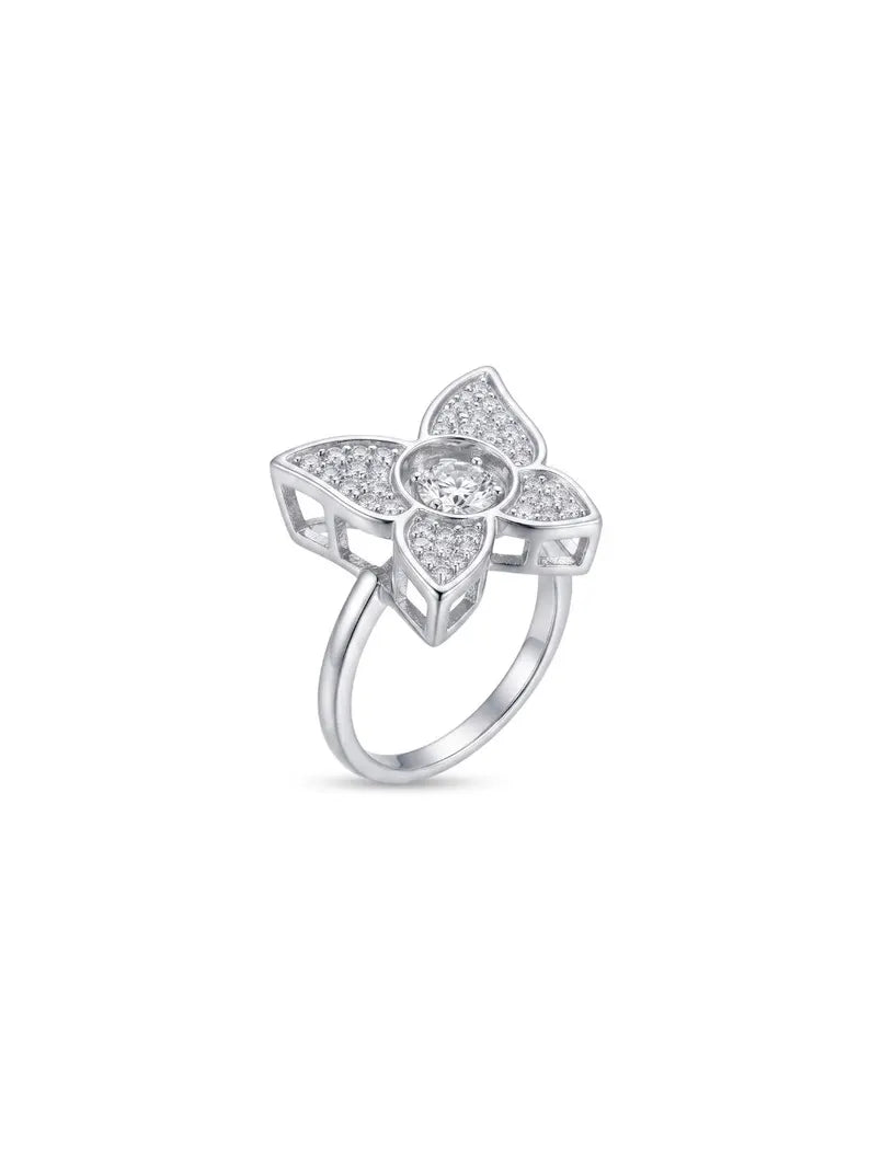 Angled view of a 925 sterling silver flower ring showing the open cut-out gallery beneath the CZ-set petals
