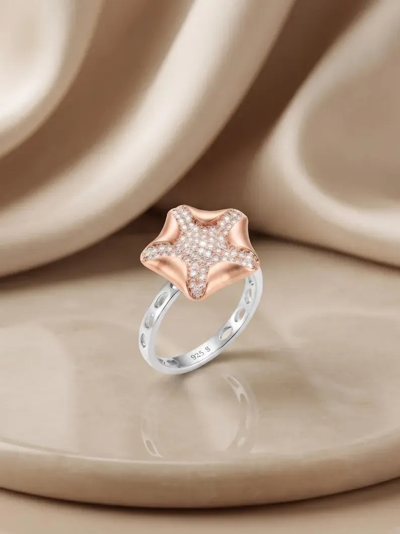 Sterling silver rings for women featuring a rose gold plated starfish design with cubic zirconia accents.