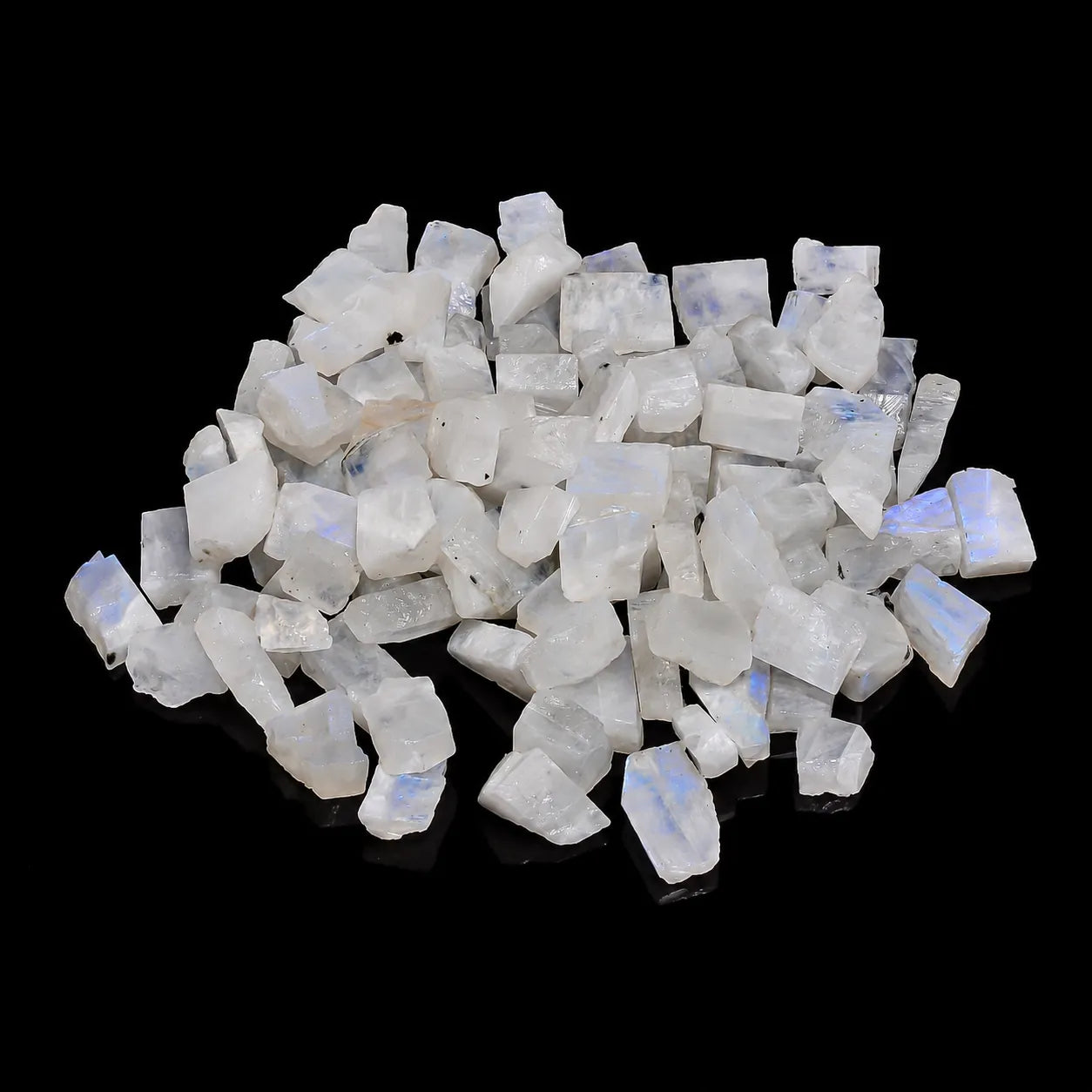 Collection of raw moonstone crystals on a black background