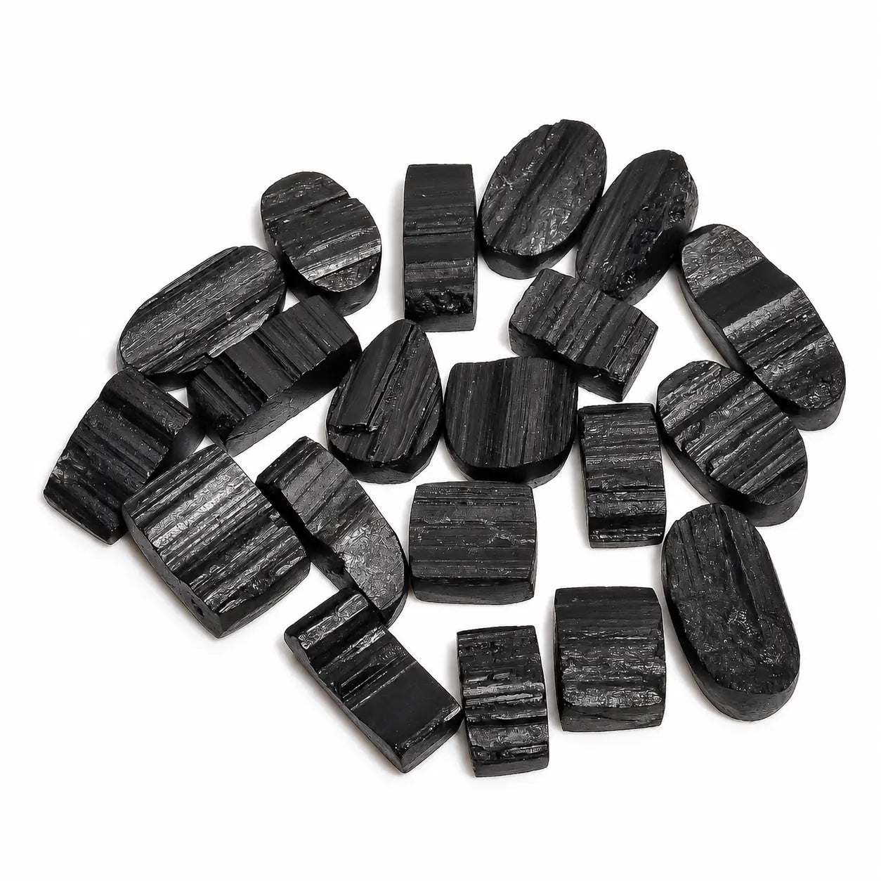 Collection of black stone beads on a white background