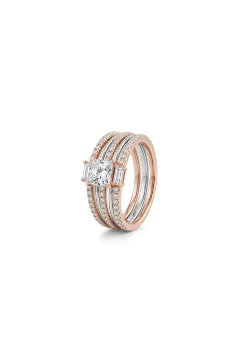 A rose gold wedding band set featuring a central princess-cut diamond surrounded by baguette and round diamonds, with matching pavé bands, shown on a white background.