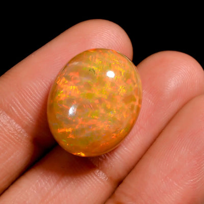 100% Natural 13 Ct Brown Ethiopian Opal with a dark base tone and vibrant green-orange flashes for custom jewelry (17X14X9 MM)