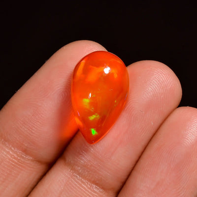 5Ct Orange Ethiopian Opal – Radiant Pear Cabochon with Visible flashes of Red, Neon Green & Gold (13×11×6 mm)