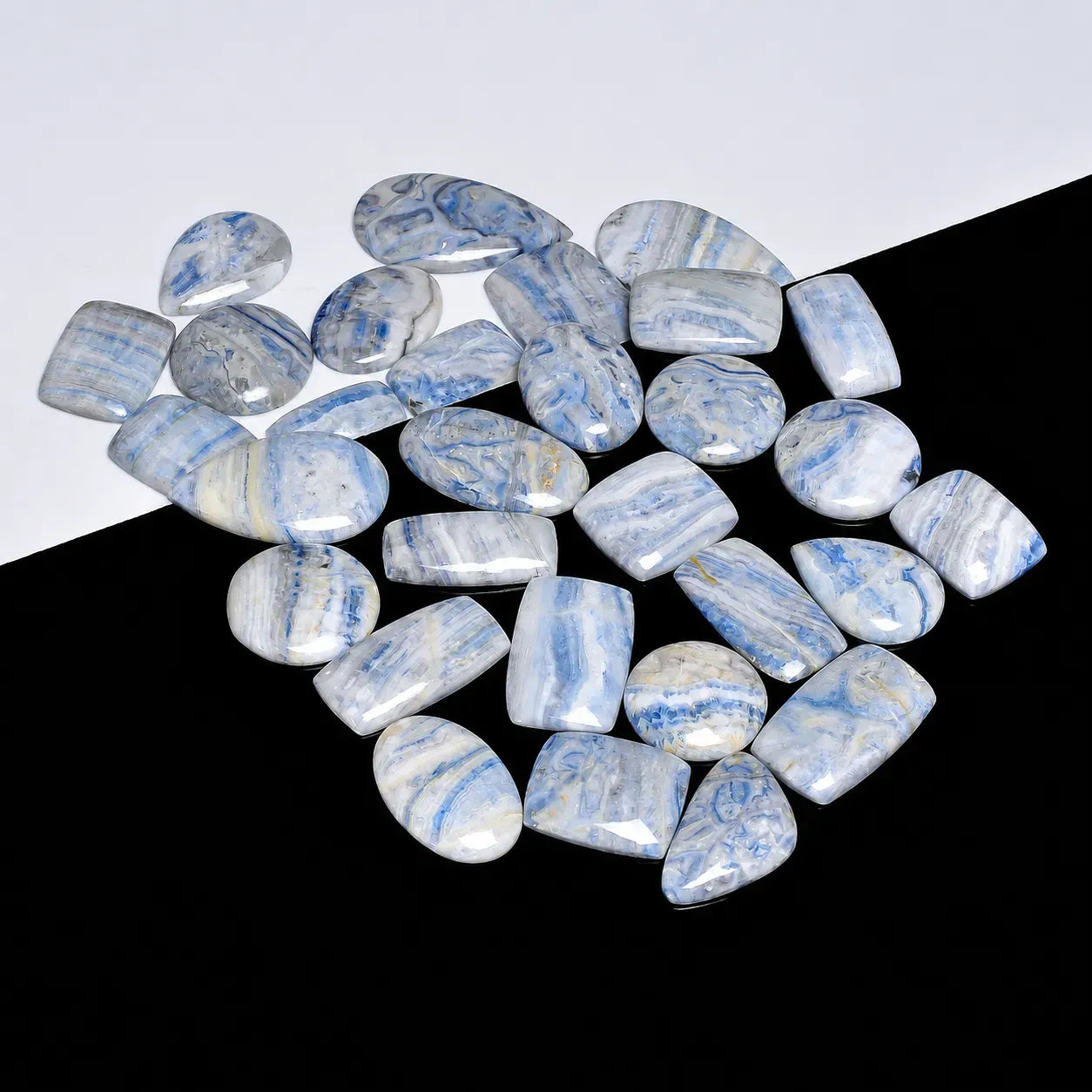 Blue and white marbled stones on a black and white background