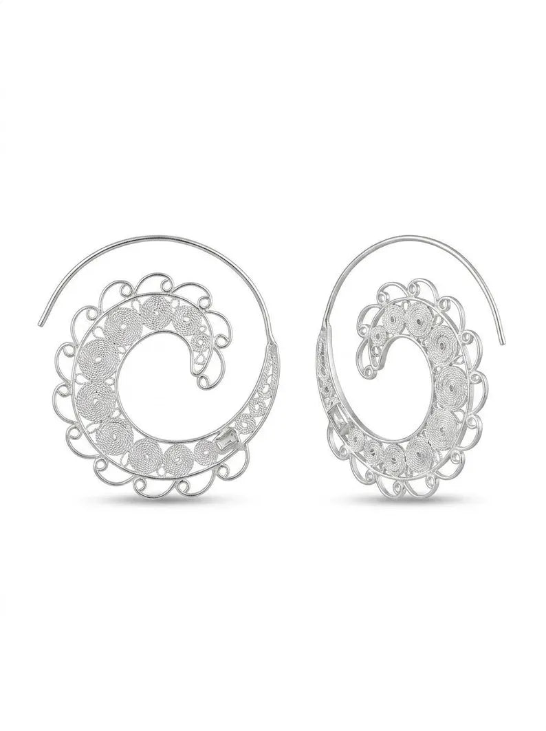 A pair of silver-toned spiral drop earrings with intricate filigree detailing and clear rhinestone accents, shown against a plain white background.