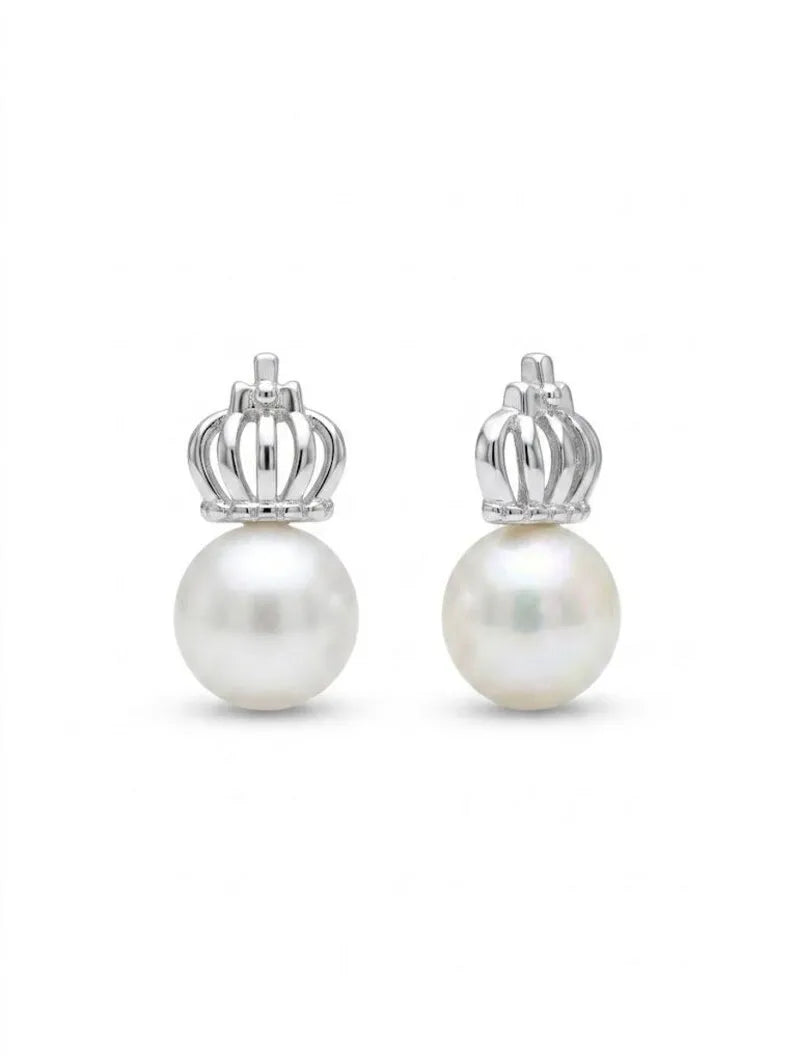 A pair of silver crown stud earrings with a single white pearl hanging from each crown, shown against a plain white background.