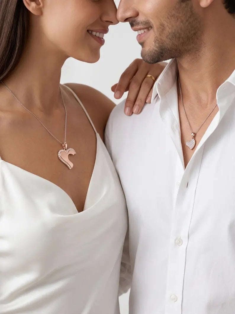 Couple wearing matching heart necklace set