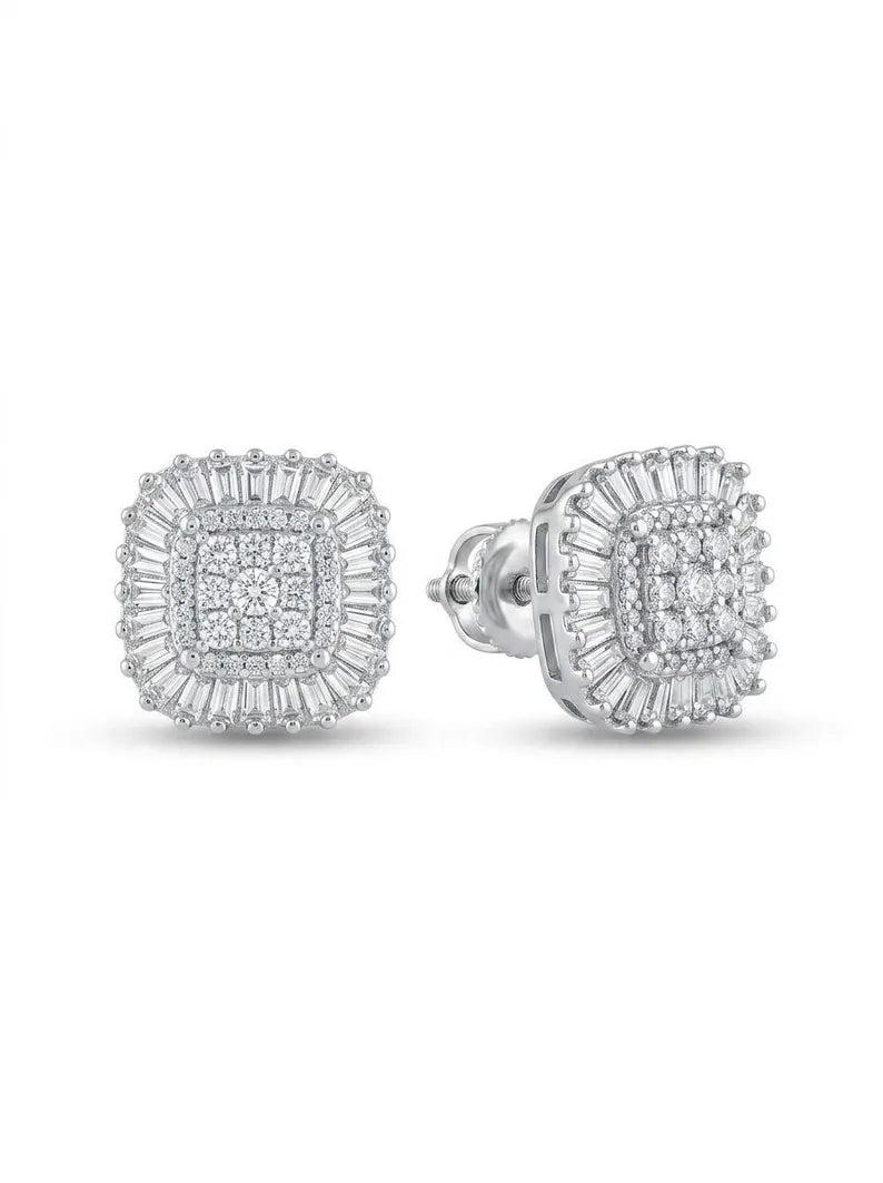 A pair of square-shaped halo stud earrings in silver-toned metal, featuring multiple rows of clear baguette and round-cut stones, shown on a plain white background.
