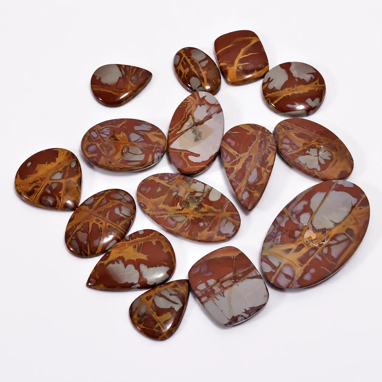 Collection of brown marbled stones on a white background