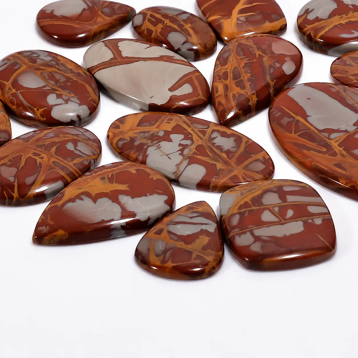 Collection of marbled brown and gray stones on a white background