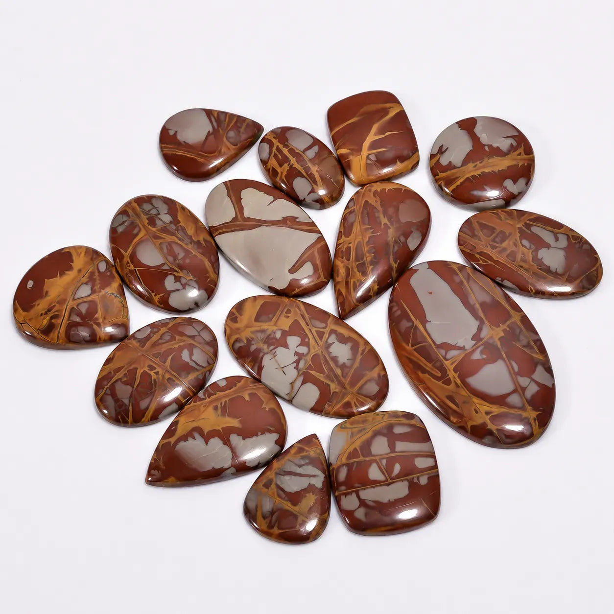 Collection of brown and gray marbled stones on a white background