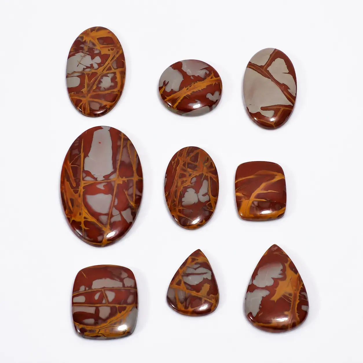 Set of marbled brown and orange stones on a white background