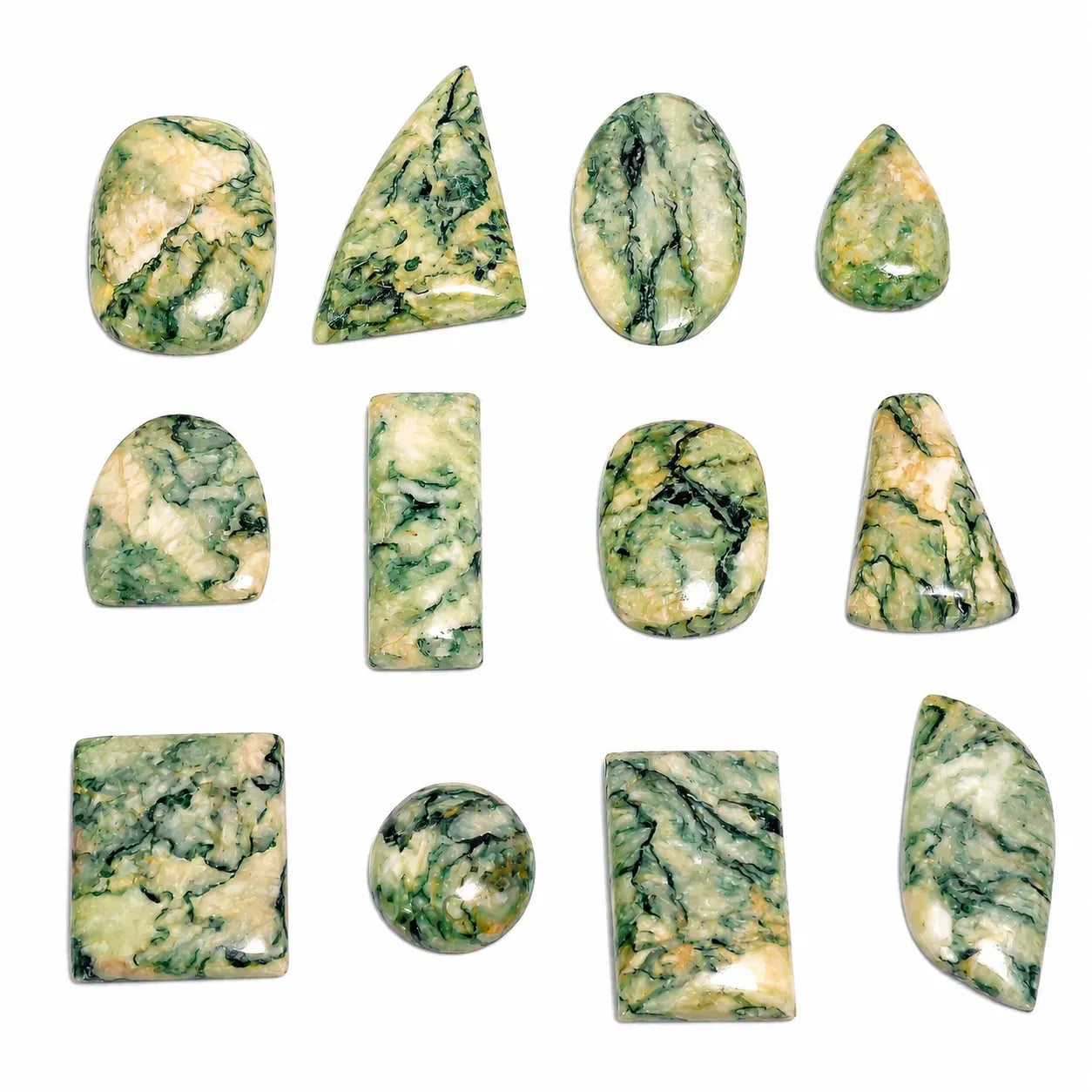 Collection of green and white marbled stones on a white background