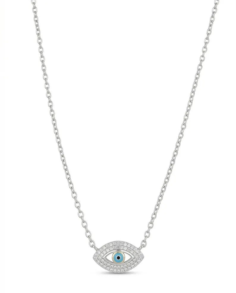 A silver-tone chain necklace featuring an evil eye pendant with a light blue center stone and clear pavé accents, shown against a plain white background.