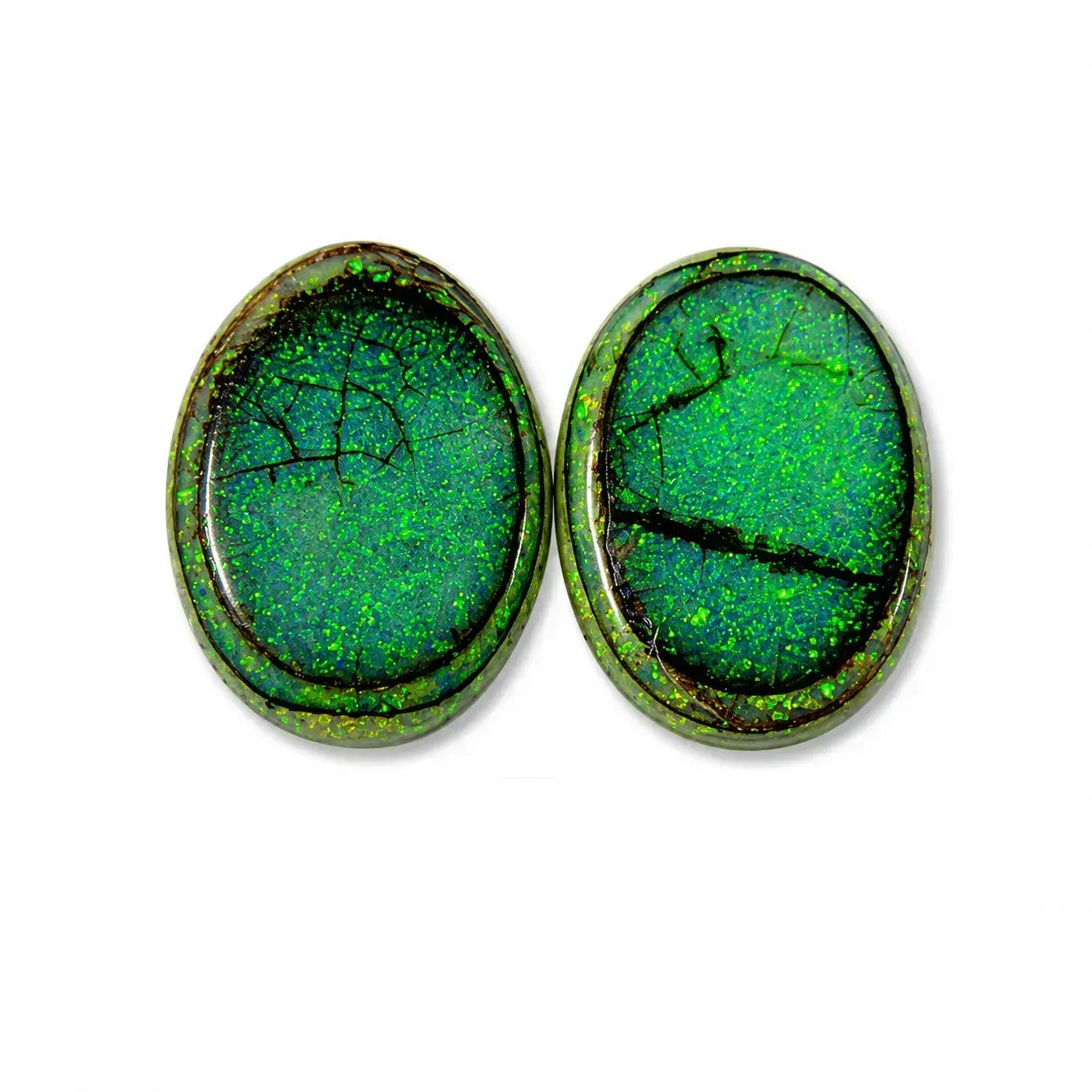 Two oval green opal cabochons with iridescent shimmer and natural crack lines, displayed side-by-side on a white background.