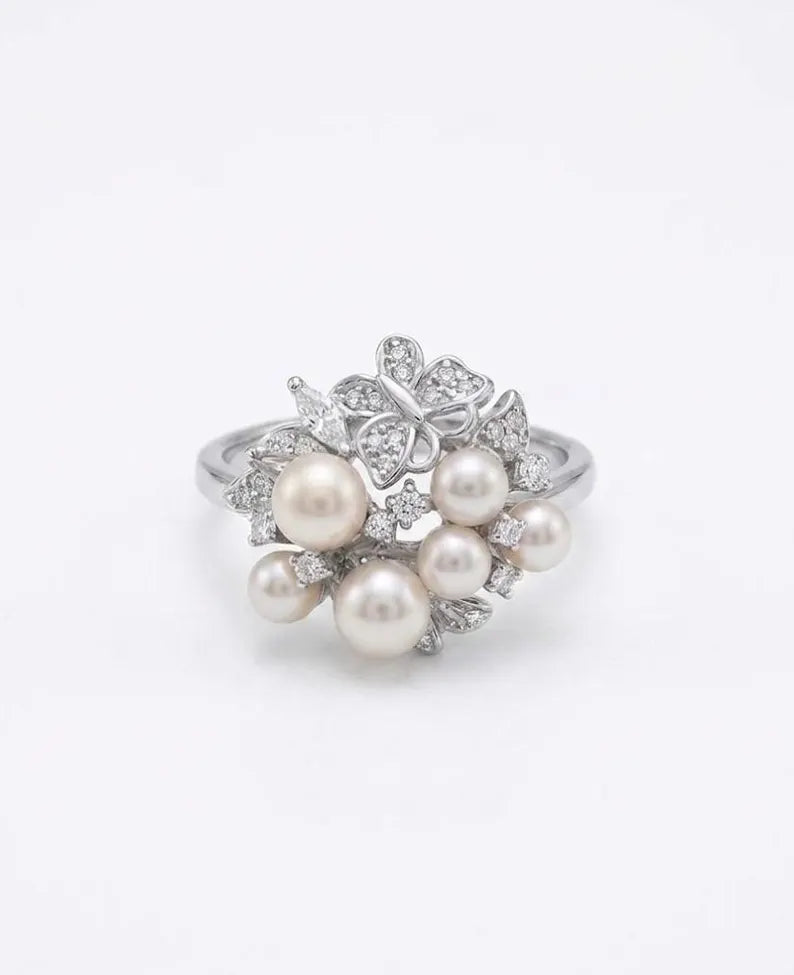 Faux pearl cluster statement ring with Cubic Zirconia twisted silver band