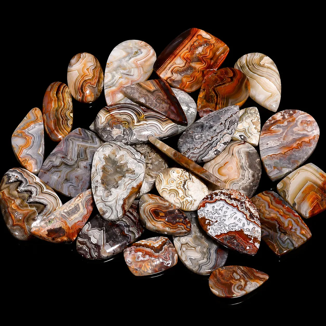 Collection of patterned stones on a black background