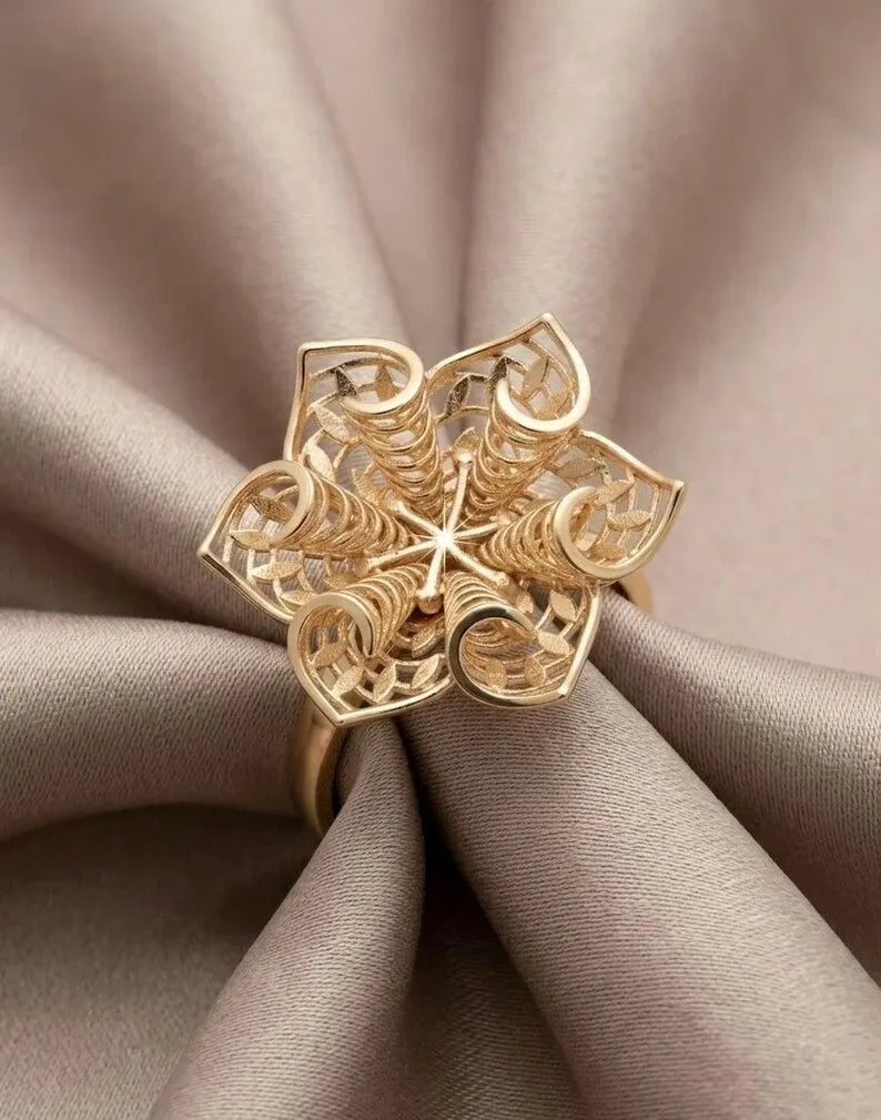Close up of 3D floral filigree ring in gold plated sterling silver, boho style