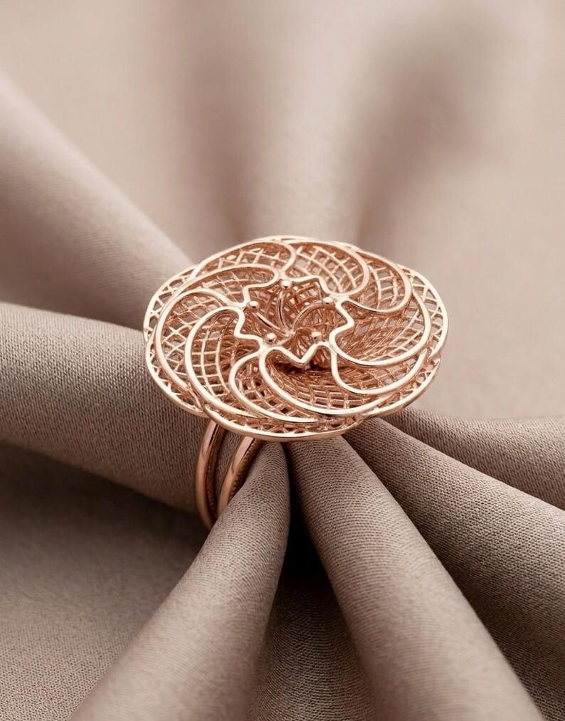 Close up of vintage inspired rose gold filigree flower ring in 925 sterling silver