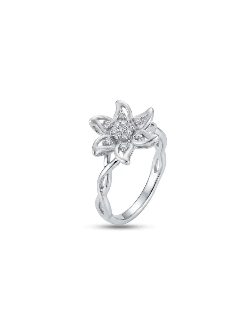 Woman wearing sterling silver flower ring with CZ cluster center near face
