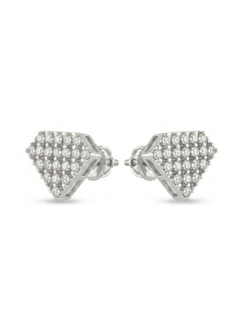 A pair of silver-tone pavé diamond stud earrings with a geometric triangular design, displayed on a clean white background.