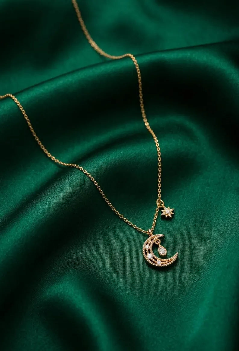 Woman wearing a gold celestial moon star necklace