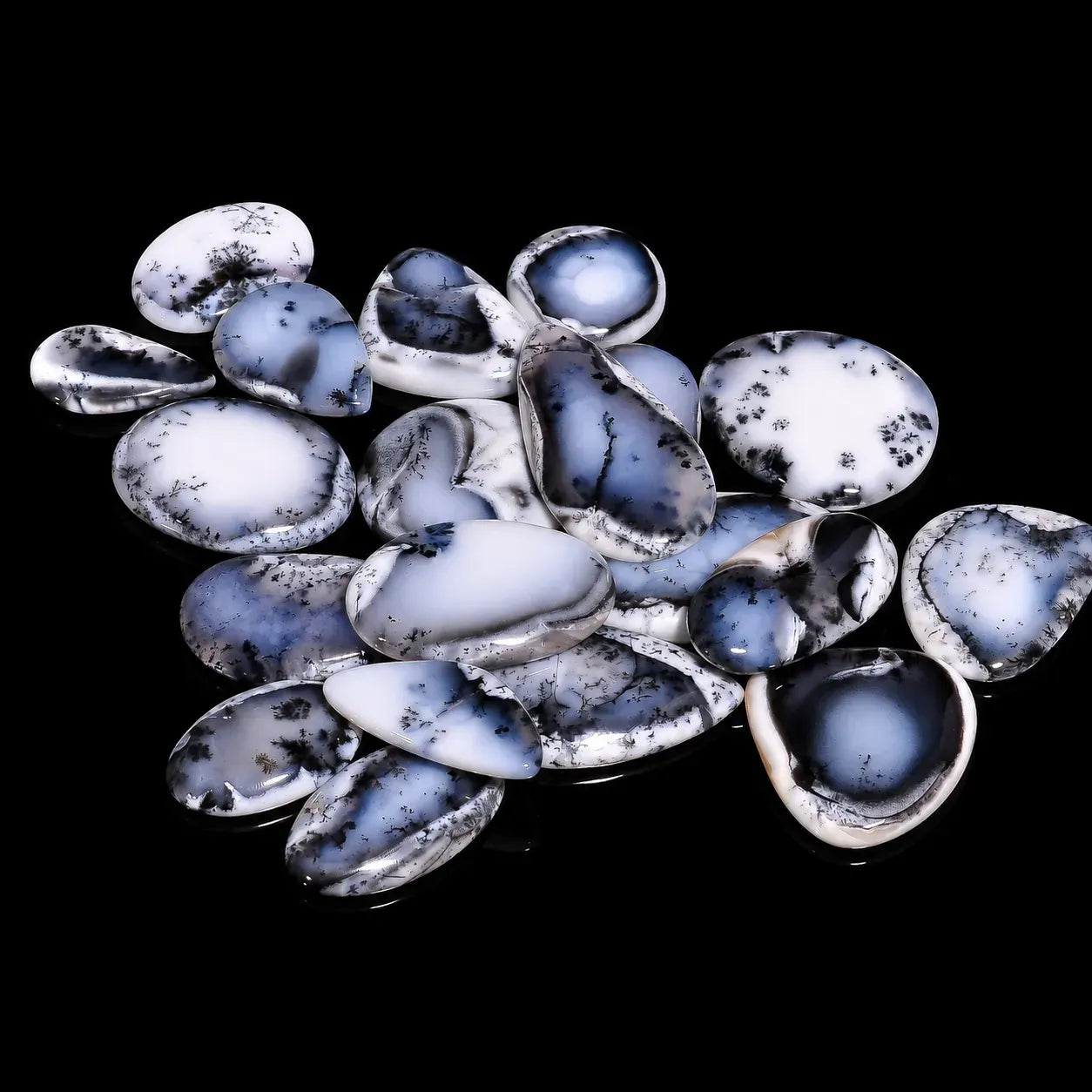 Collection of blue and white stones on a black background