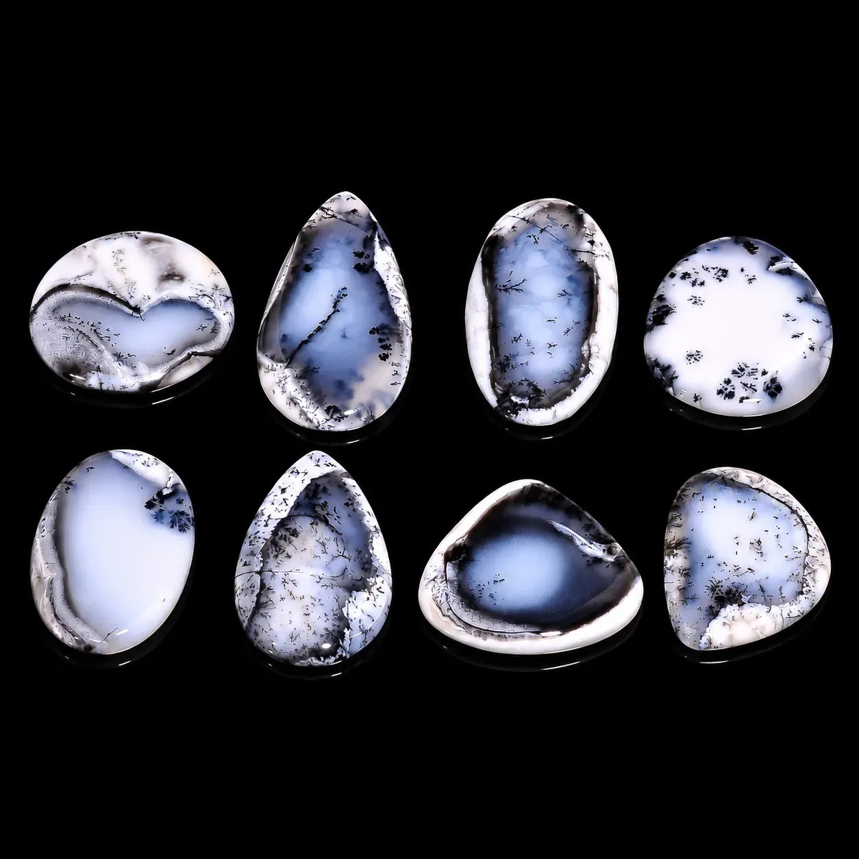 Set of blue and white marbled stones on a black background