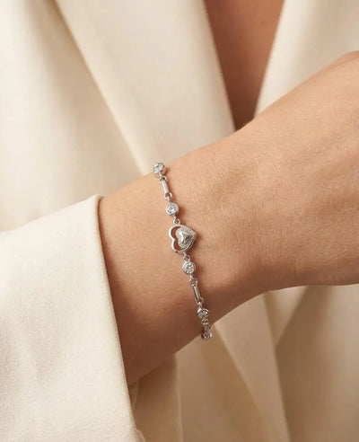 925 sterling silver double heart bracelet with sparkling bezel-set stones and an adjustable fit