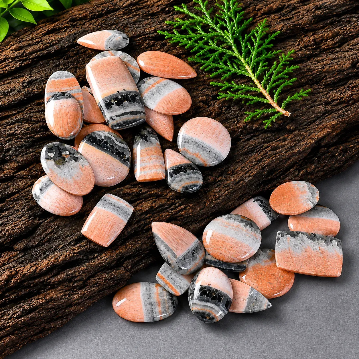 Decorative pebbles with a natural wood and green leaf background