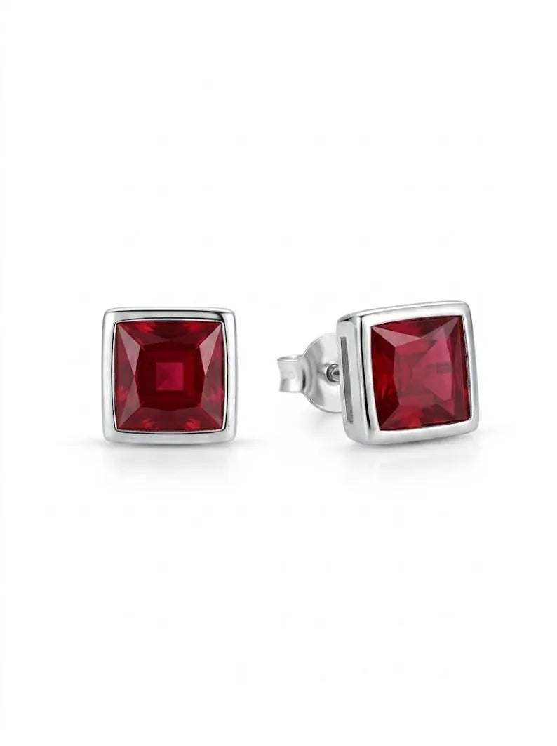 Square garnet stud earring, close-up