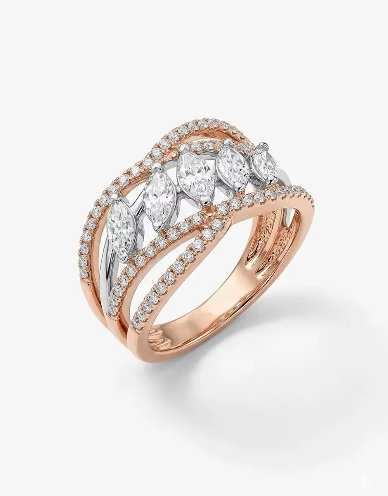 Close up of rose gold and silver marquise cluster statement ring with crisscross pave band