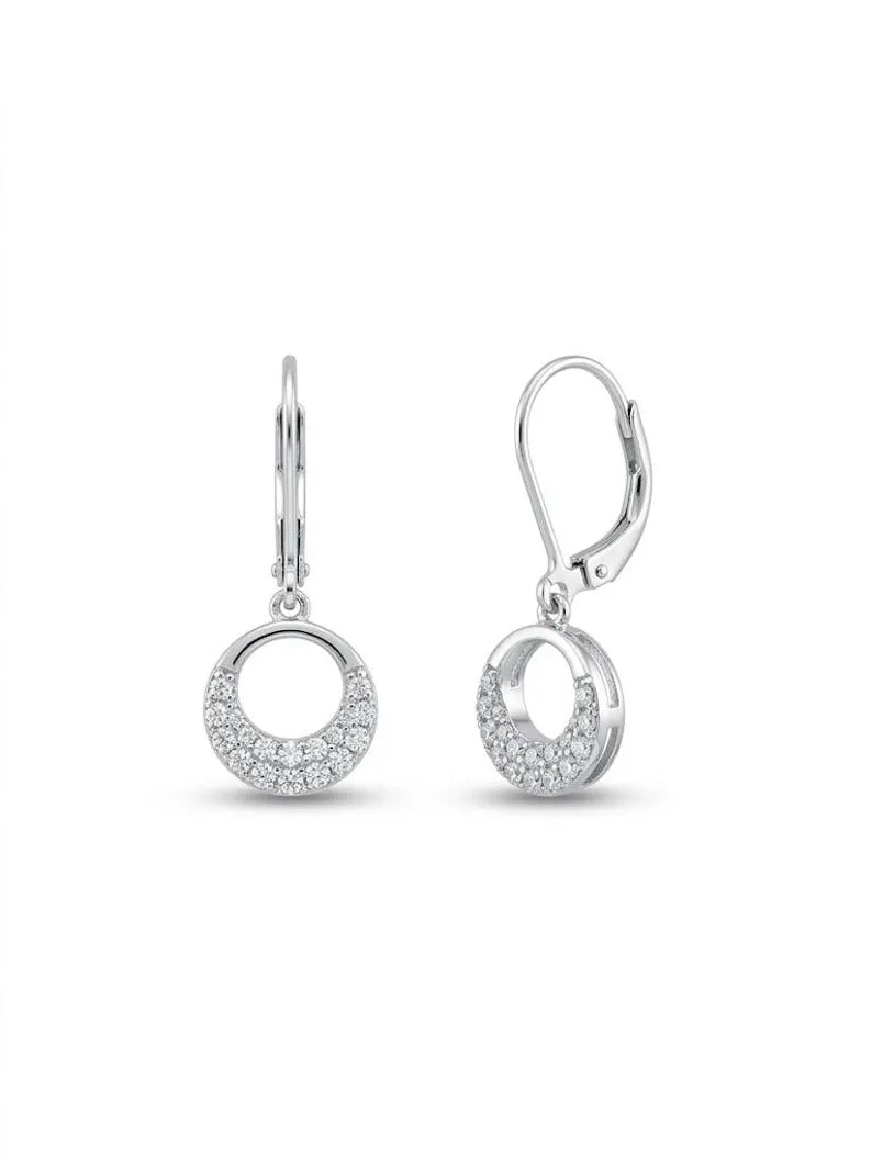 A pair of silver leverback earrings with crescent moon-shaped dangles paved with small clear stones, shown on a plain white background.