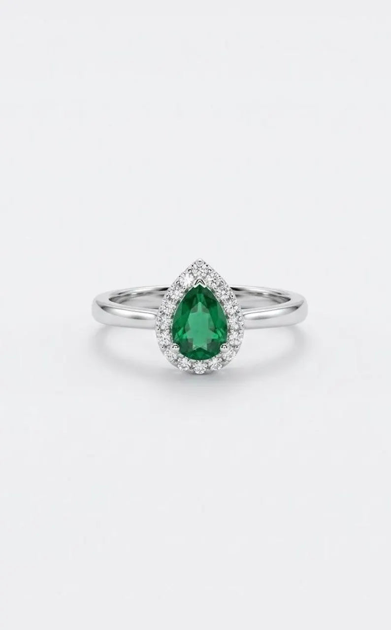 Front view of 925 sterling silver pear cut emerald green cubic zirconia promise ring