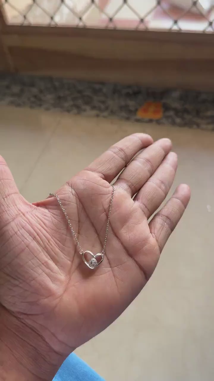 Silver open heart necklace with round zircon solitaire