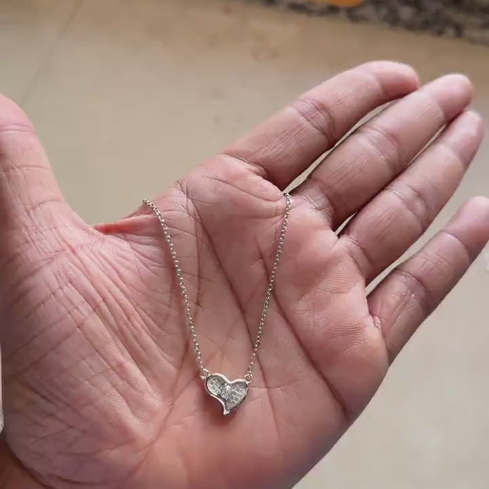 Fine chain and clasp detail on silver heart necklace
