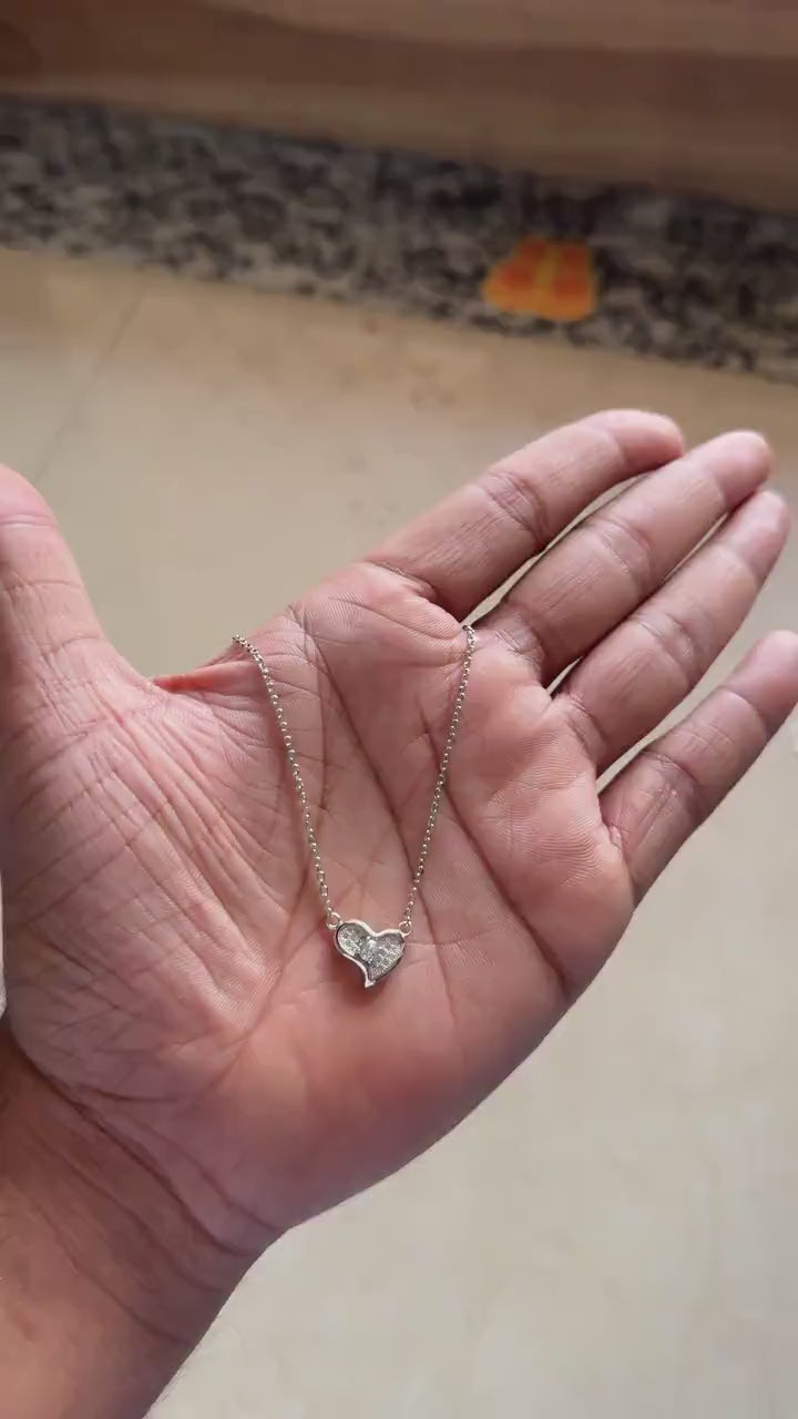 Fine chain and clasp detail on silver heart necklace