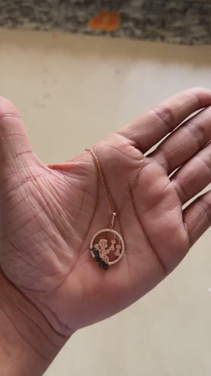 Rose gold angel pendant necklace worn around the neck