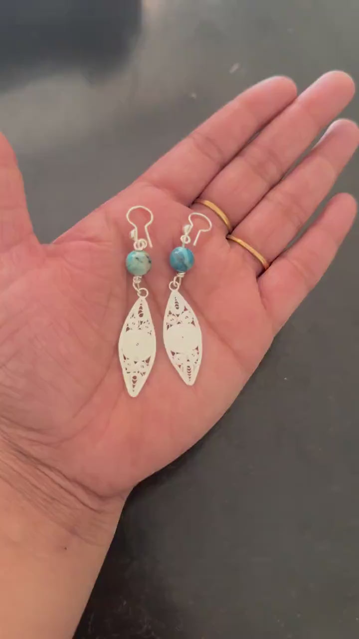 Marquise filigree earrings shown from the side