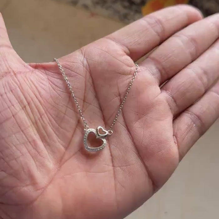 Celebrate love and romance with this beautifully crafted 925 Sterling Silver Heart Necklace. This elegant necklace features a timeless heart-shaped design with sparkling zircon pavé stones, creating a meaningful jewelry piece that represents love, affection, and emotional connection.