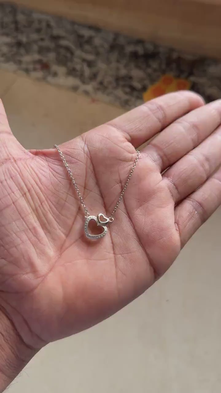Celebrate love and romance with this beautifully crafted 925 Sterling Silver Heart Necklace. This elegant necklace features a timeless heart-shaped design with sparkling zircon pavé stones, creating a meaningful jewelry piece that represents love, affection, and emotional connection.