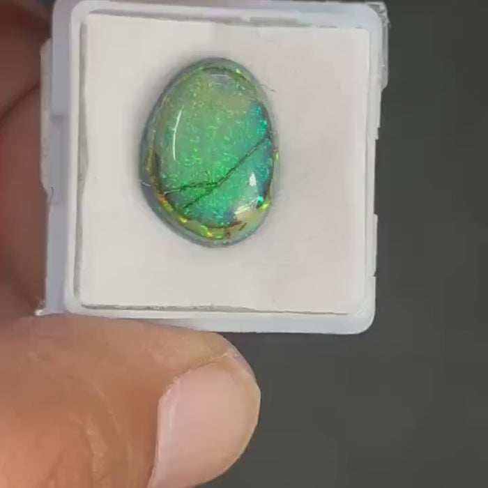 Video showcasing fire and color play in Fancy Shape Monarch Opal Cabochon