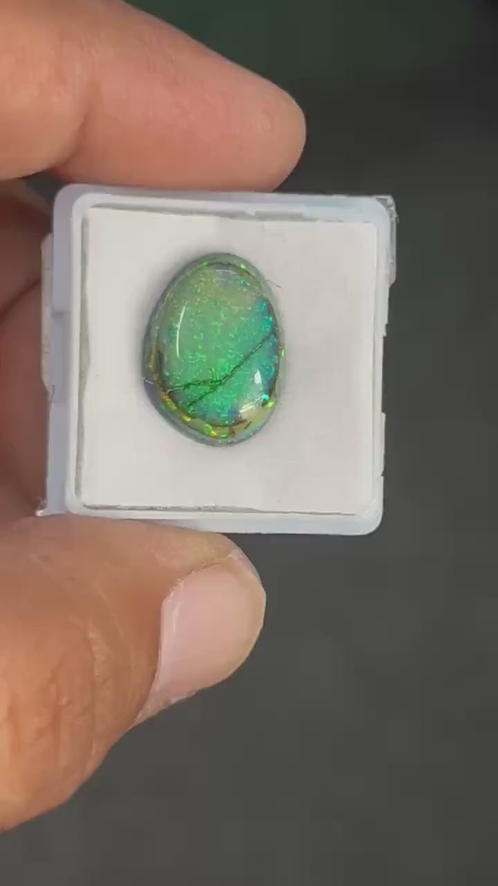 Video showcasing fire and color play in Fancy Shape Monarch Opal Cabochon