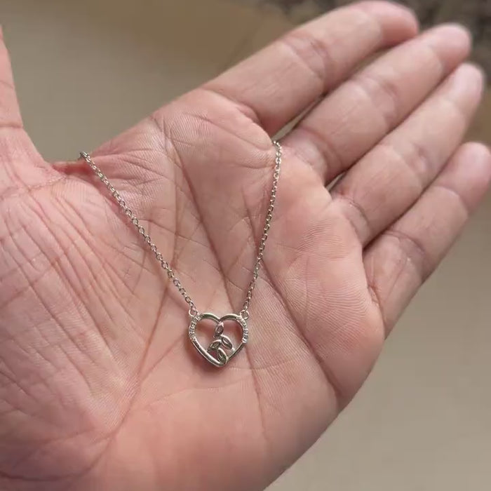 Silver heart pendant with leaf detail and pavé zircon outline