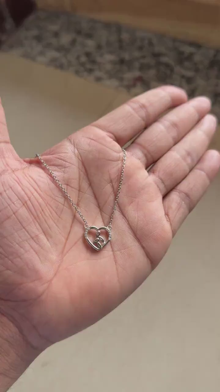 Silver heart pendant with leaf detail and pavé zircon outline