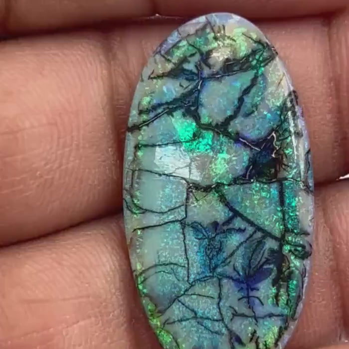 Video showcasing fire and color play in 10 Carat Monarch Opal Cabochon