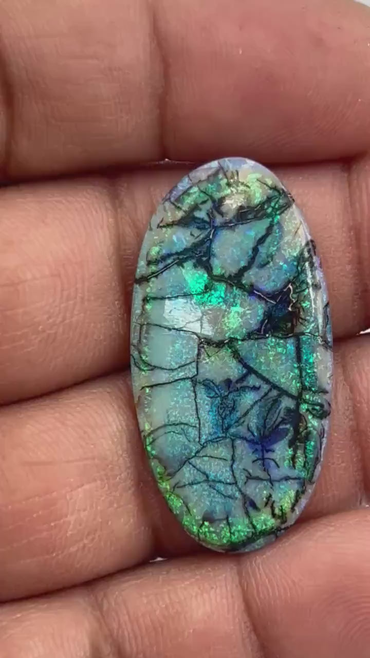 Video showcasing fire and color play in 10 Carat Monarch Opal Cabochon