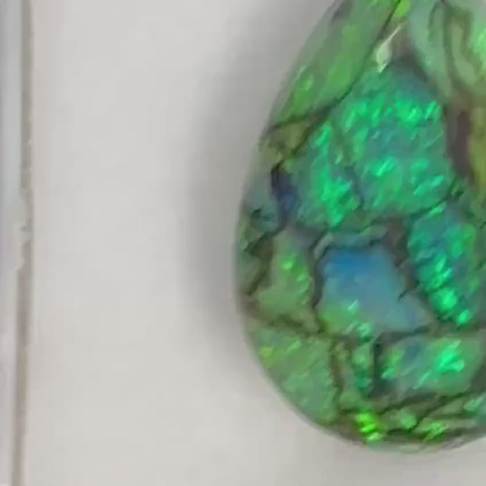 Video showcasing fire and color play in Pear Shape Sterling Opal accent stone